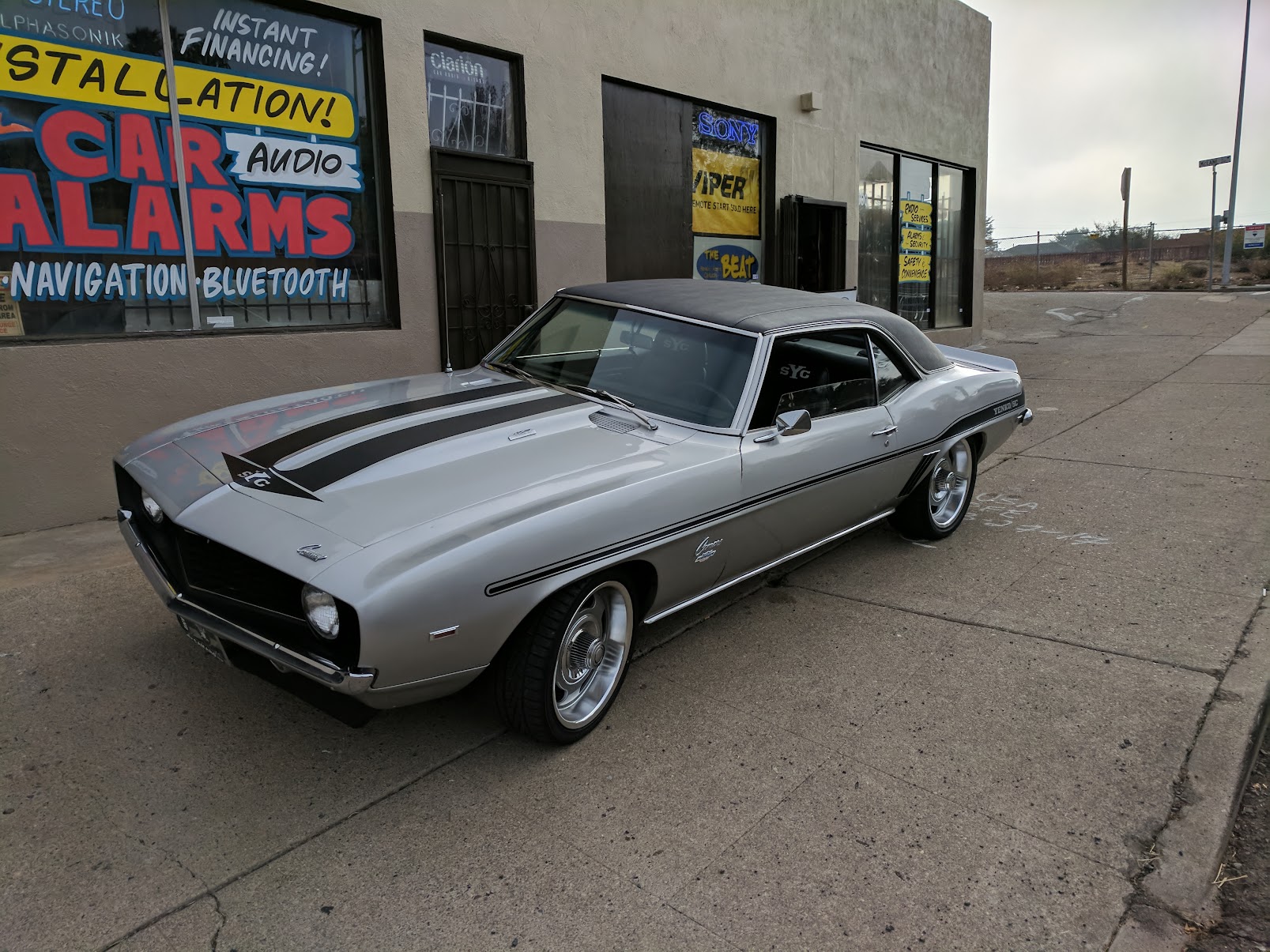 Gray Car in Front of the Store